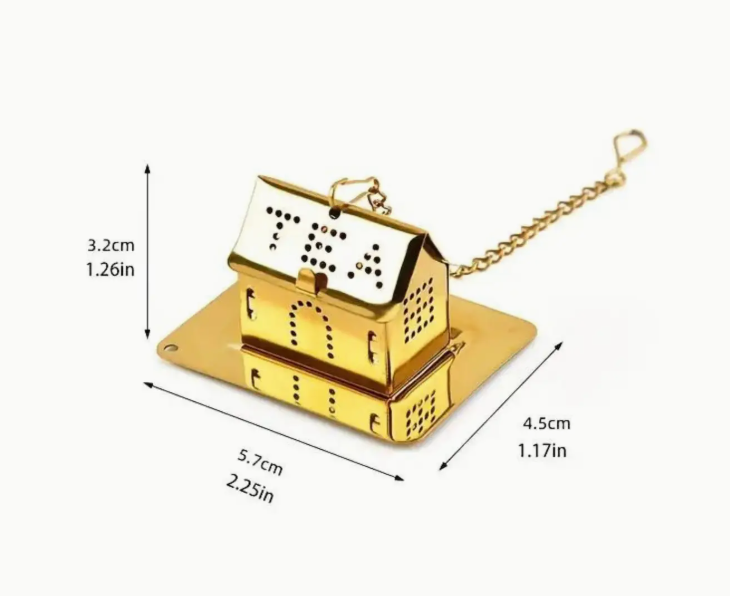 Gold-colored tea infuser with chain and measurement details on a white background